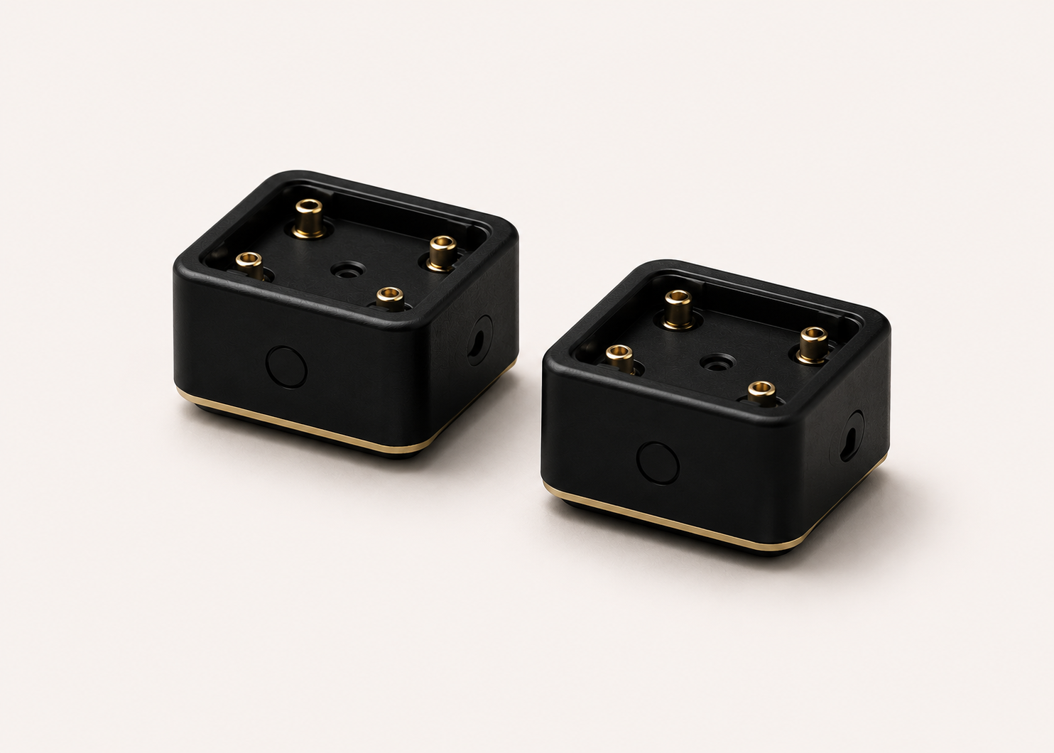 Free Clicker instrument modules — pair of matte black cubes with brass contact pins